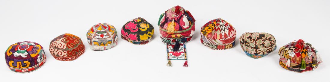 8 Central Asian Embroidered Caps: 8 Central Asian Embroidered Caps. Largest size: 6'' x 8'' x 8'' (15 x 20 x 20 cm).