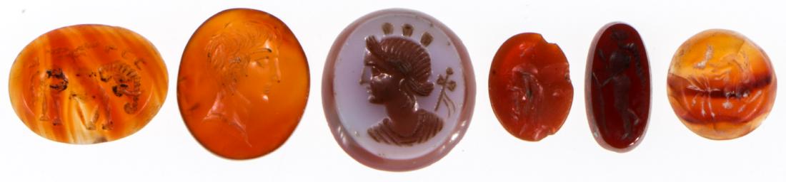 6 Ancient Carved Carnelian Seals: 6 Ancient Carved Carnelian Seals. Largest size: 7/8" x 3/4" (2 x 3 cm).
