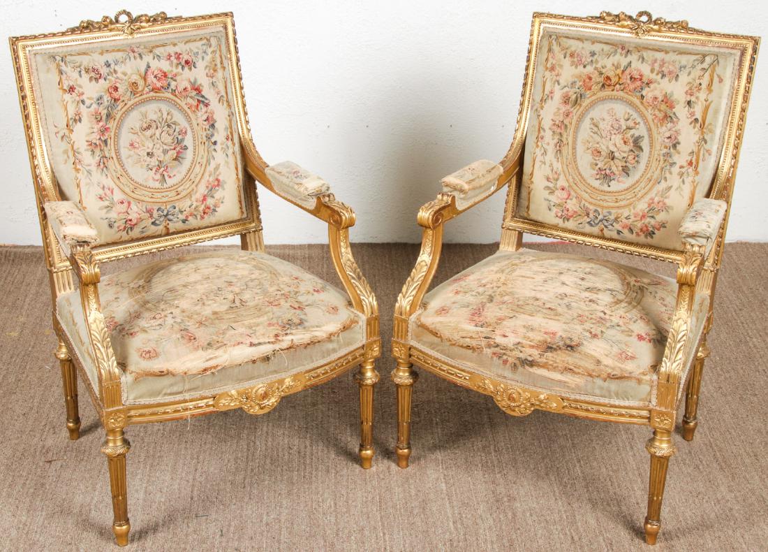 Pair of Antique Louis XVI Style Armchairs: Pair of Antique Louis XVI Style Armchairs, gilt, worn Aubusson tapestry. Each size: 39'' x 25'' x 23'' (99 x 64 x 58 cm). Maryland estate.