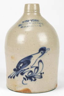 NEW YORK STONEWARE CO. JUG: NEW YORK STONEWARE CO. JUG. With cobalt blue motif of bird on branch; salt glaze. Size: 11'' x 7'' x 7.25'' (28 x 18 x 18 cm).