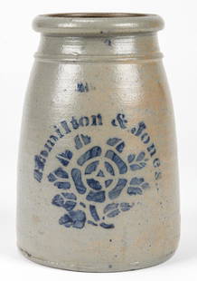 HAMILTON & JONES GREENSBORO PA, STONEWARE JAR: HAMILTON & JONES GREENSBORO PA, STONEWARE JAR. With cobalt blue rose and stencil type motif; salt glaze. Size: 9.5'' H x 6.5'' Diameter (24 x 17 cm).