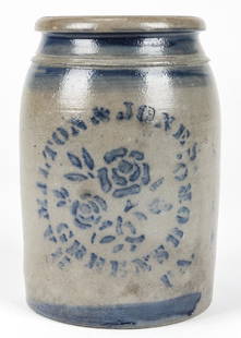 HAMILTON & JONES GREENSBORO PA STONEWARE JAR: HAMILTON & JONES GREENSBORO PA, STONEWARE JAR. With cobalt blue rose and stencil type motif; salt glaze. Size: 9.5''H x 6.5''Diameter (24 x 17 cm).