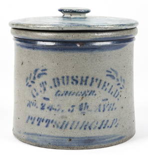 C.T. BUSHFIELD PITTSBURGH, PA, STONEWARE LIDDED JAR: C.T. BUSHFIELD PITTSBURGH, PA, STONEWARE LIDDEC JAR. With cobalt blue leaf and stencil type motif; salt glaze. Size: 8'' H x 8.25'' Diameter (20 x 21 cm).