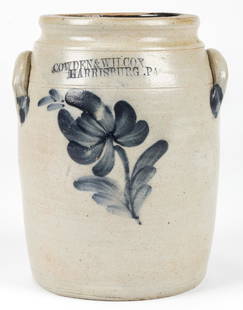 COWDEN & WILCOX HARRISBURG .PA. STONEWARE JAR: COWDEN & WILCOX HARRISBURG .PA. STONEWARE JAR. With cobalt blue flower motif; salt glaze. Size: 9.5'' x 7'' x 6.5'' (24 x 18 x 17 cm).