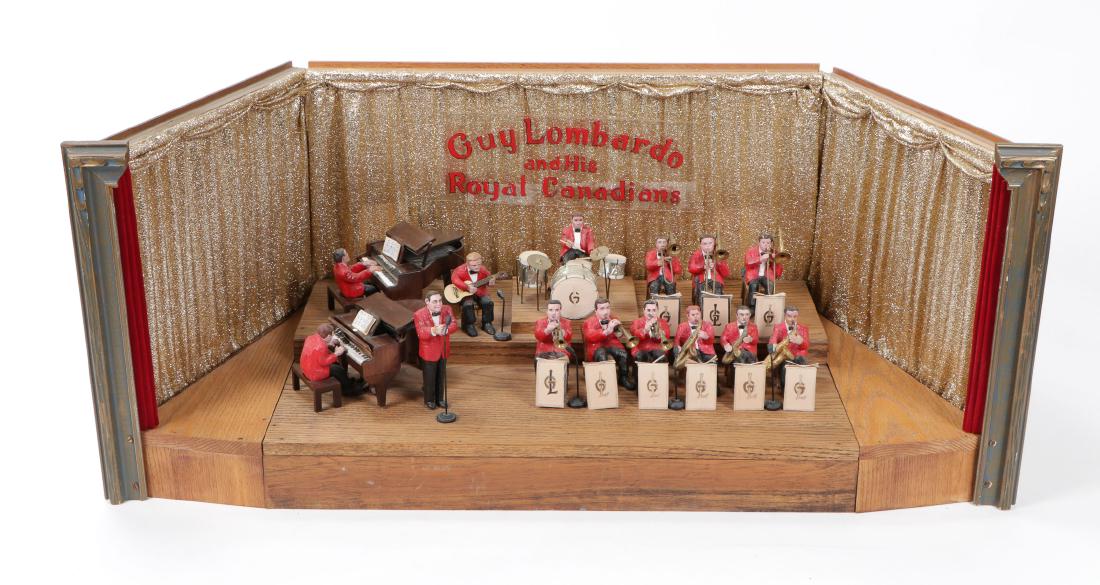 Guy Lombardo and His Royal Canadians Diorama: Guy Lombardo and His Royal Canadians, Folk Art Diorama, mid 20th C. Fourteen handmade and painted musicians, including the famous Canadian-American bandleader and violinist of Italian descent, Guy Lom