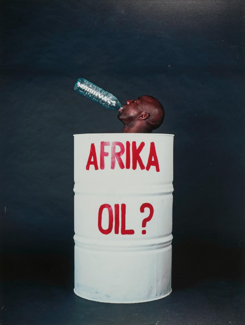 Barthelemy Toguo (Cameroon, b. 1967) "Afrika Oil": Barthelemy Toguo (Cameroon, b. 1967) "Afrika Oil", 2005-2008. Epson Luster Print on Aluminum. Size: 21.25'' x 16'' (54 x 41 cm). Exhibition Photograph from "Africa: See You, See Me". Provenance: Priva