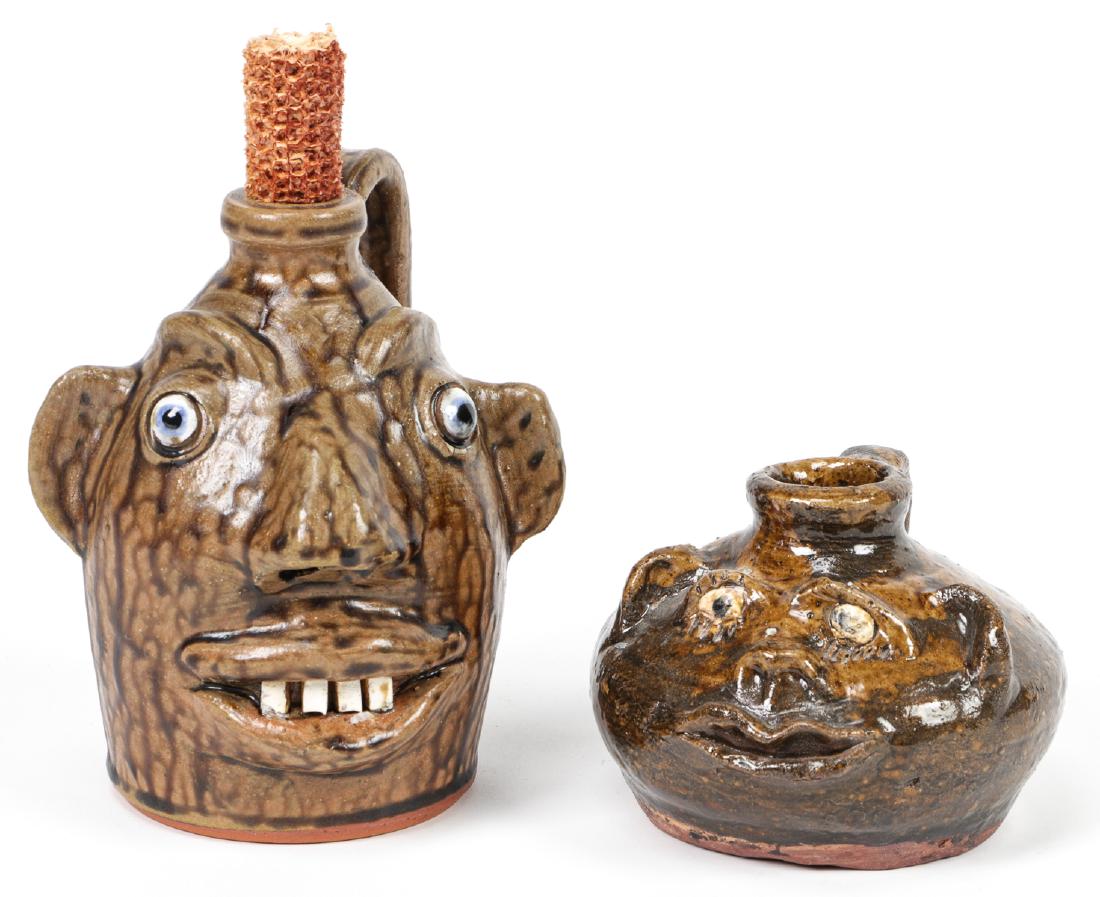 2 Southern Folk Art Face Jugs: Mary Rogers and Whelchel: 2 Southern Folk Art Face Jugs: Mary Rogers and Whelchel Meaders. Largest Size: 8.5'' x 6'' x 5'' (22 x 15 x 13 cm). Provenance: Ricardo Viera Collection.