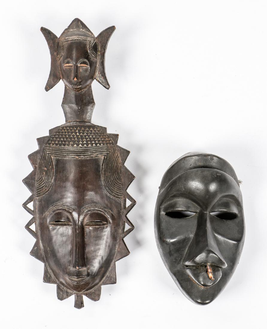 2 African Masks, Baule & Dan Gagon: 2 African Masks: 1) Baule carved wood mask, Ivory Coast, Africa; 2) Dan Gagon mask with inset tooth, Ivory Coast. Provenance: The Estate of Mary Bert Gutman, Pennsylvania. Sizes: 17.5'' x 7'' x 3.25''