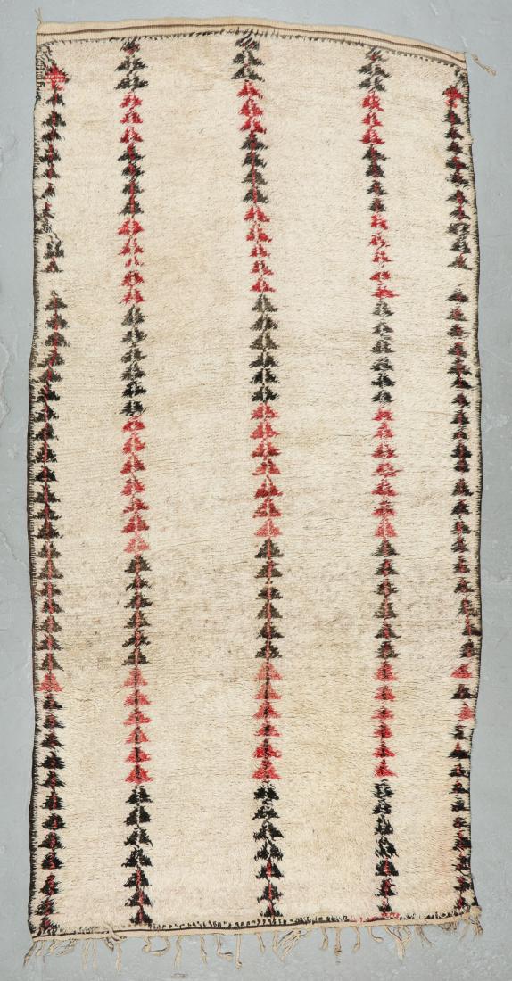 Vintage Wool Moroccan Pile Rug: 5'5'' x 10'11'': Vintage Wool Moroccan Pile Rug: 5'5'' x 10'11'' (165 x 333 cm). 22 lbs. Note on terms for estimating the age of an item: Antique (100+ years). Semi-Antique (50-100 years). Vintage (20-50 years). Moder