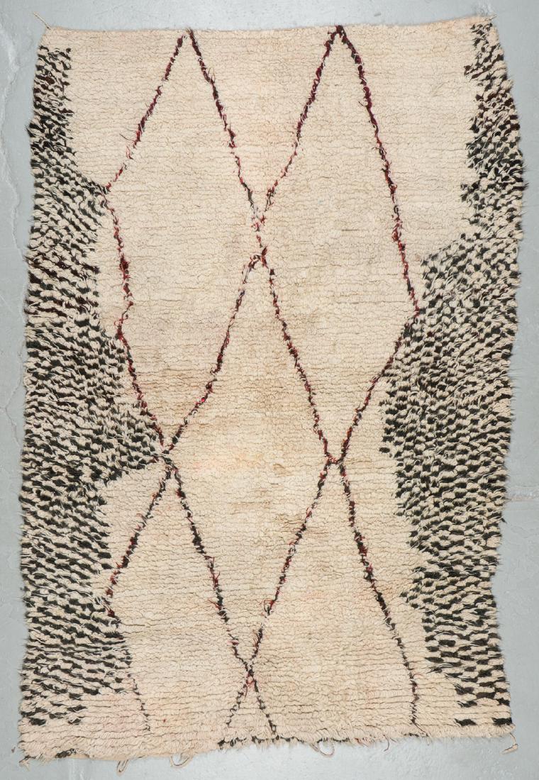 Vintage Wool Moroccan Pile Rug: 5'5'' x 8'1'': Vintage Wool Moroccan Pile Rug: 5'5'' x 8'1'' (165 x 246 cm). 19 lbs. Note on terms for estimating the age of an item: Antique (100+ years). Semi-Antique (50-100 years). Vintage (20-50 years). Modern 