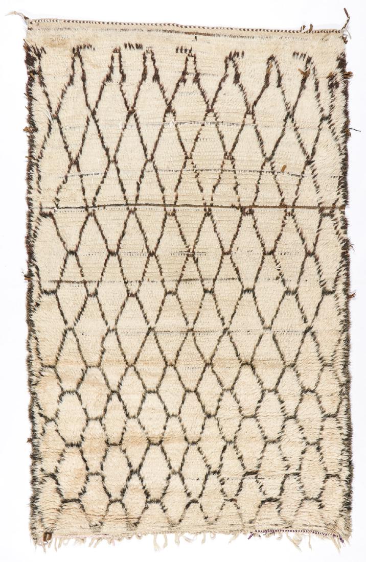 Vintage Beni Ourain Rug, Morocco: 5'4'' x 8'8'': Vintage Beni Ourain Rug, Morocco: 5'4'' x 8'8'' (163 x 264 cm). 19 lbs. Note on terms for estimating the age of an item: Antique (100+ years). Semi-Antique (50-100 years). Vintage (20-50 years). Moder
