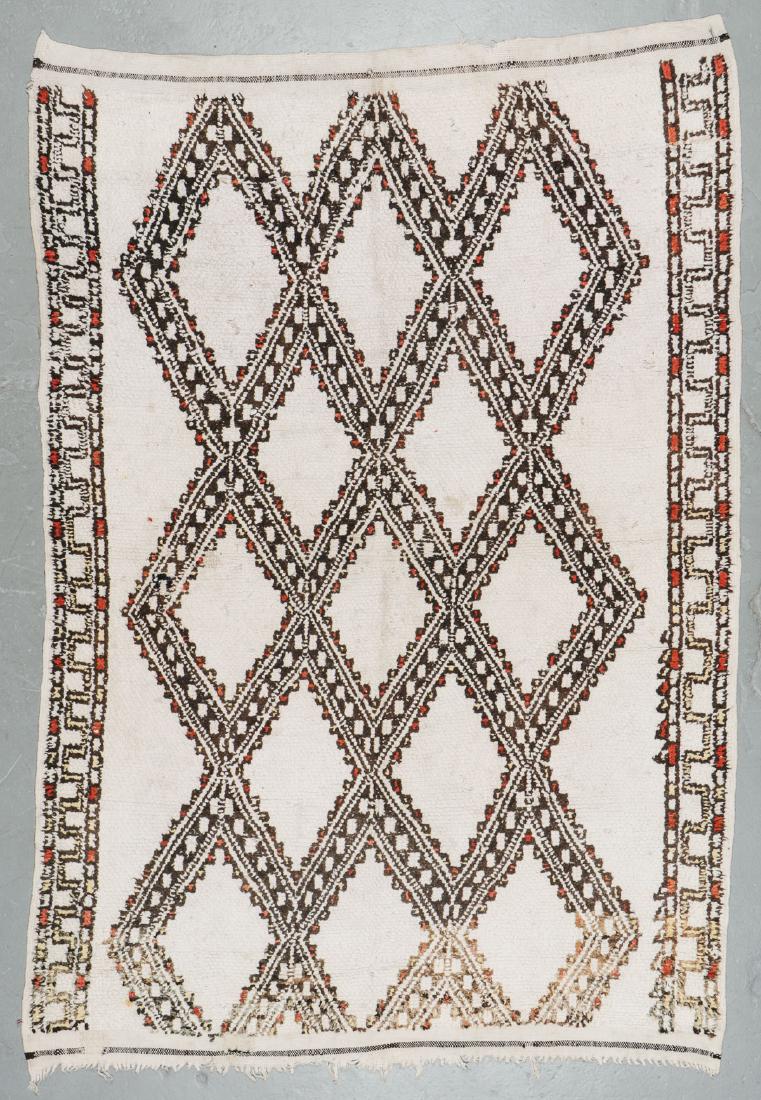 Vintage Wool Moroccan Pile Rug: 5'11'' x 8'7'': Vintage Wool Moroccan Pile Rug: 5'11'' x 8'7'' (180 x 262 cm). 16 lbs. Note on terms for estimating the age of an item: Antique (100+ years). Semi-Antique (50-100 years). Vintage (20-50 years). Modern