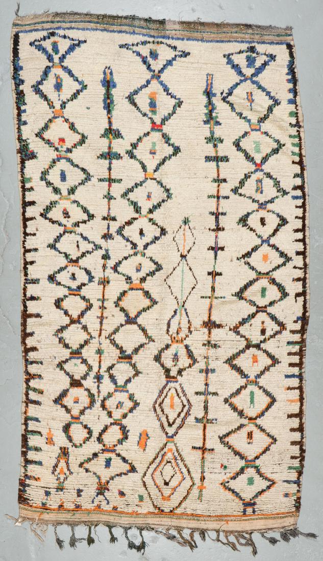 Vintage Wool Moroccan Pile Rug: 5'5'' x 9'8'': Vintage Wool Moroccan Pile Rug: 5'5'' x 9'8'' (165 x 295 cm). 17 lbs. Note on terms for estimating the age of an item: Antique (100+ years). Semi-Antique (50-100 years). Vintage (20-50 years). Modern 