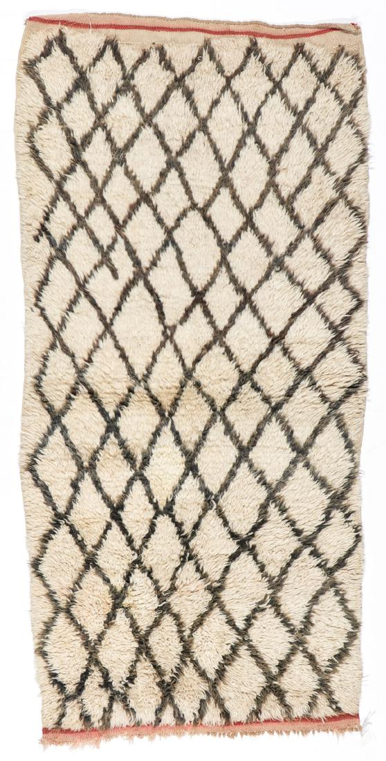 Vintage Wool Moroccan Pile Rug: 3'0'' x 6'3'': Vintage Wool Moroccan Pile Rug: 3'0'' x 6'3'' (91 x 191 cm). 9 lbs. Note on terms for estimating the age of an item: Antique (100+ years). Semi-Antique (50-100 years). Vintage (20-50 years). Modern (u
