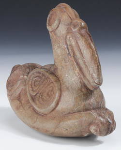 Taino Serpentine Zoomorphic Effigy (1000-1500 CE): Taino Serpentine Zoomorphic Effigy (1000-1500 CE) featuring complex bird forms integrated into the body. A humming bird rests on the large bird beak, its bill resting on the larger bird's forehead.