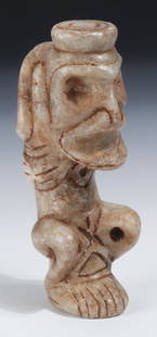 Taino Impressive Large Marble Pendant (1000-1500 CE): Taino Impressive Large Marble Pendant (1000-1500 CE). Slit indicates gender. Platform on head indicates the pendant and represents a cohoba stand. Face between legs, eyes are pierced holes. Free