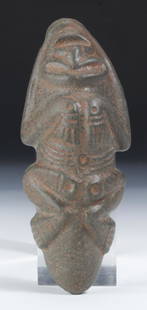 Taino Ax-like Form (1000-1500 CE): Taino Ax-like form (1000-1500 CE). Full Anthropic figure with reversed head. Made of a grey basalt-like stone. Size: 2'' x 2.5'' x 6.5'' (5 x 6 x 17 cm). Provenance: Larry Roberts, author of Taino