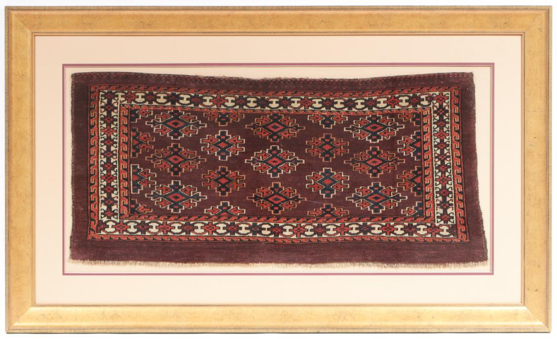 Antique Yomud Torba, Turkmenistan, in Custom Frame: Antique Yomud Torba, Turkmenistan, in Custom Frame. Size: 17'' x 38'', 43 x 97 cm (textile); 30'' x 50'', 76 x 127 cm (frame). PLEASE NOTE: successful buyers may let us know if they want any items rem