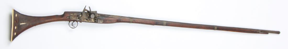 Antique North African Camel Gun: Antique North African Camel Gun. 18th/19th Century. Flintlock with bone inlaid stock. Size: 58.5'' x 6.5'' (149 x 17 cm).