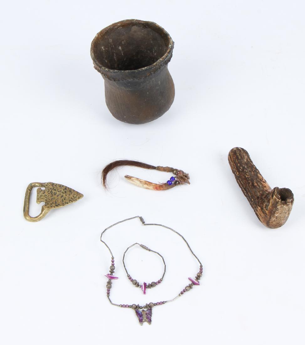 Estate Artifact Grouping: Estate Artifact Grouping: including a Brass Arrowhead Buckle; Navajo Silver Necklace and Bracelet; Shaman's Charm, collected in Montana and Iroquois Earthenware Jar, New York. Ranging in size from: 2.
