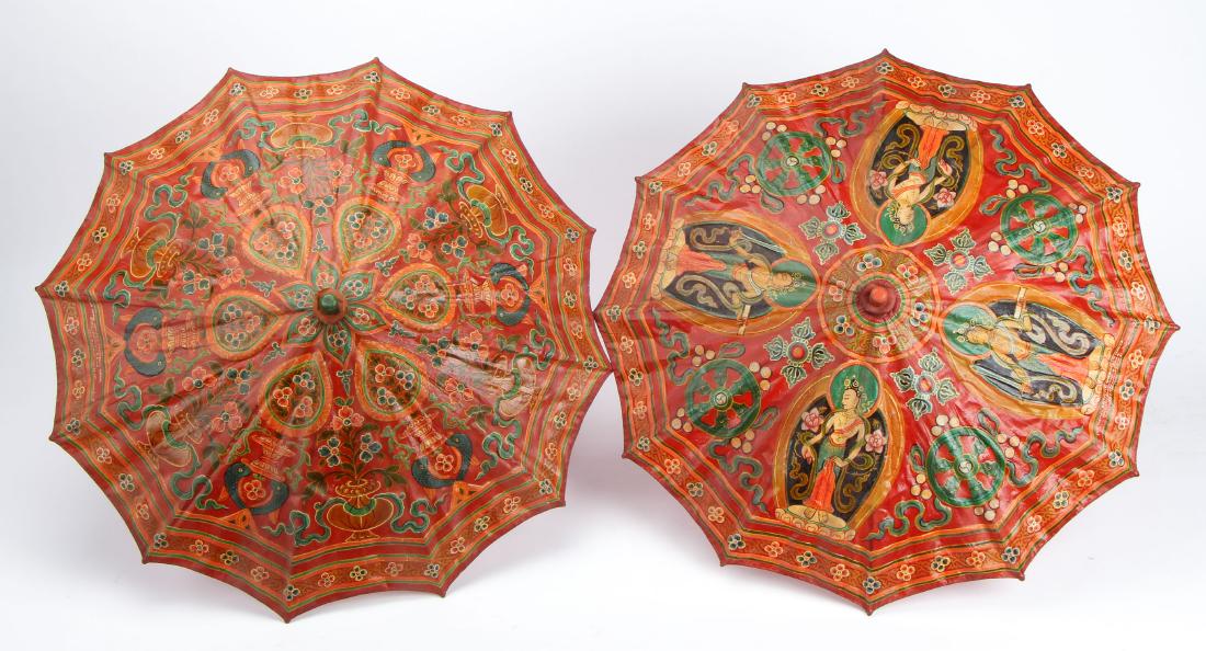 Pair of Hand Painted Nepali Ceremonial Umbrellas: Pair of Vintage, hand painted, Nepalese ceremonial umbrellas with red painted wooden finials and stems. Size: 25.5''H x 32'' Diameter (opened) (65 x 81 cm).