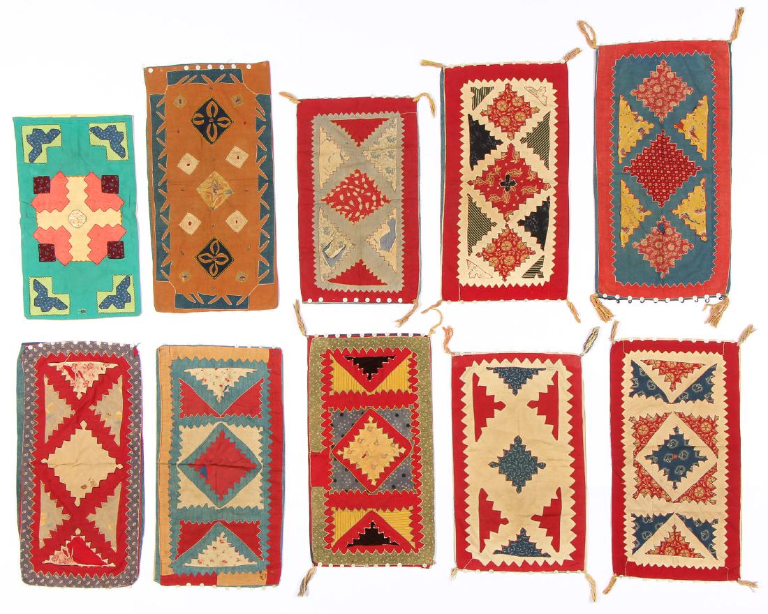 Collector's Lot of Antique Ethnographic Textiles,: Collection of antique cotton applique pillow cases, possibly Canadian, made with cotton and old shell buttons, 8 antique and 1 vintage. Largest size: 33'' x 18'' (84 x 46 cm).