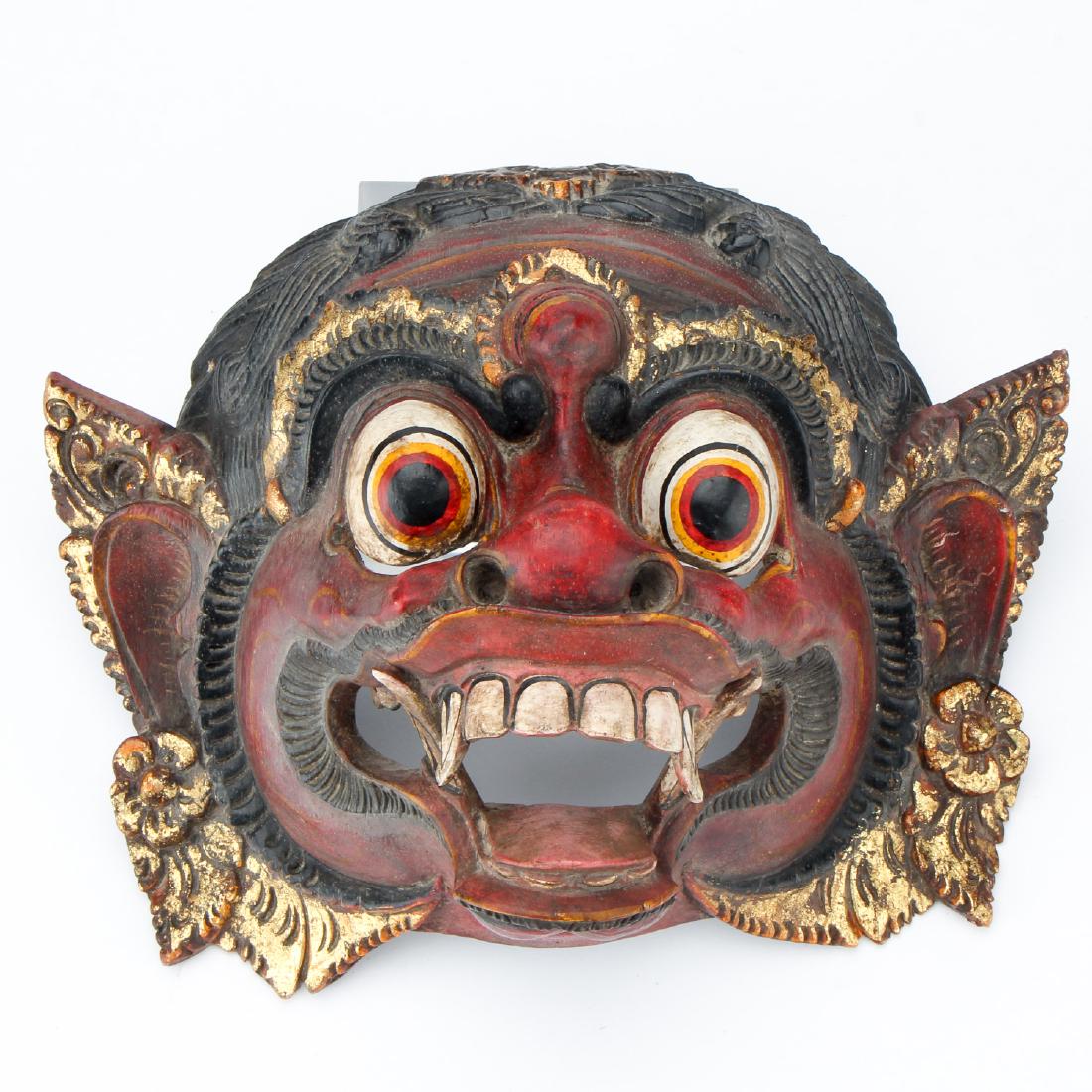 Antique Barong Mask from Bali, Indonesia: Well Carved Antique Barong Mask from Bali, Indonesia - An expressive Balinese Barong mask, carved entirely from a single piece of wood. Carved with bulging eyes, flared nostrils and bared teeth, he is
