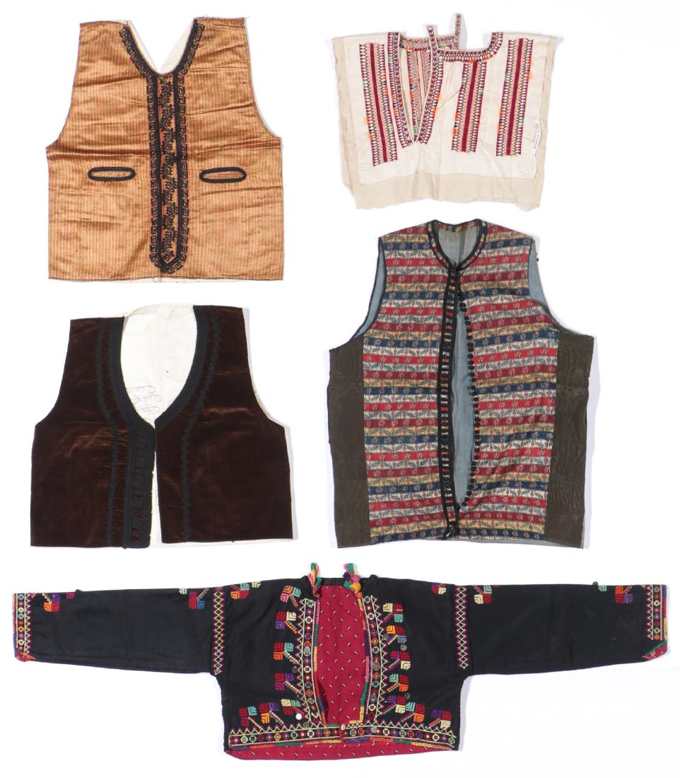 5 Antique Ethnographic Vests: Five Beautiful Antique Ethnographic Vests, an Afghani white silk vest with silk embroidery in purple, green, orange and blue and cotton lined, a black cotton vest with silk cross stitch embroidery lin