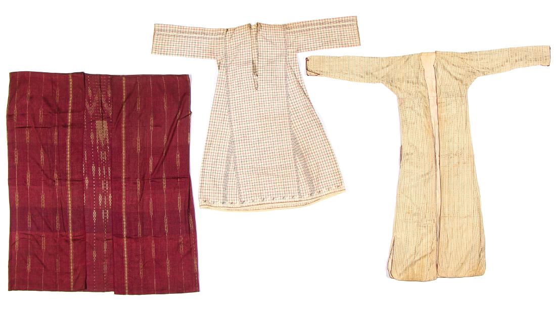 3 Antique Syrian/Middle Eastern Textiles: Three Antique Syrian/Middle Eastern Aba/Cloaks/caftan. One aba in purple silk with gold detail and one beige silk with purple and green striped detail and cotton lining, possibly Turkish. The caftan i