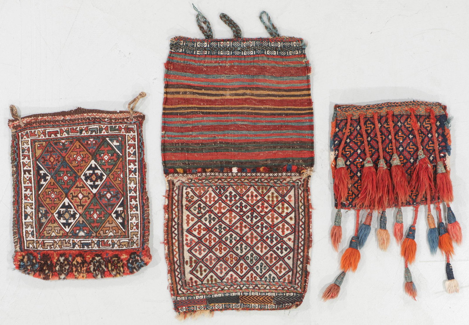3 Southwest Persian Chanteh: 3 Southwest Persian Chanteh, including an Afshar Sumak, 14" x 17"; a Luri Flatweave, 12" x 11"; and a Qashgai Flatweave, 14" x 15". Provenance: Eric Jacobson collection.