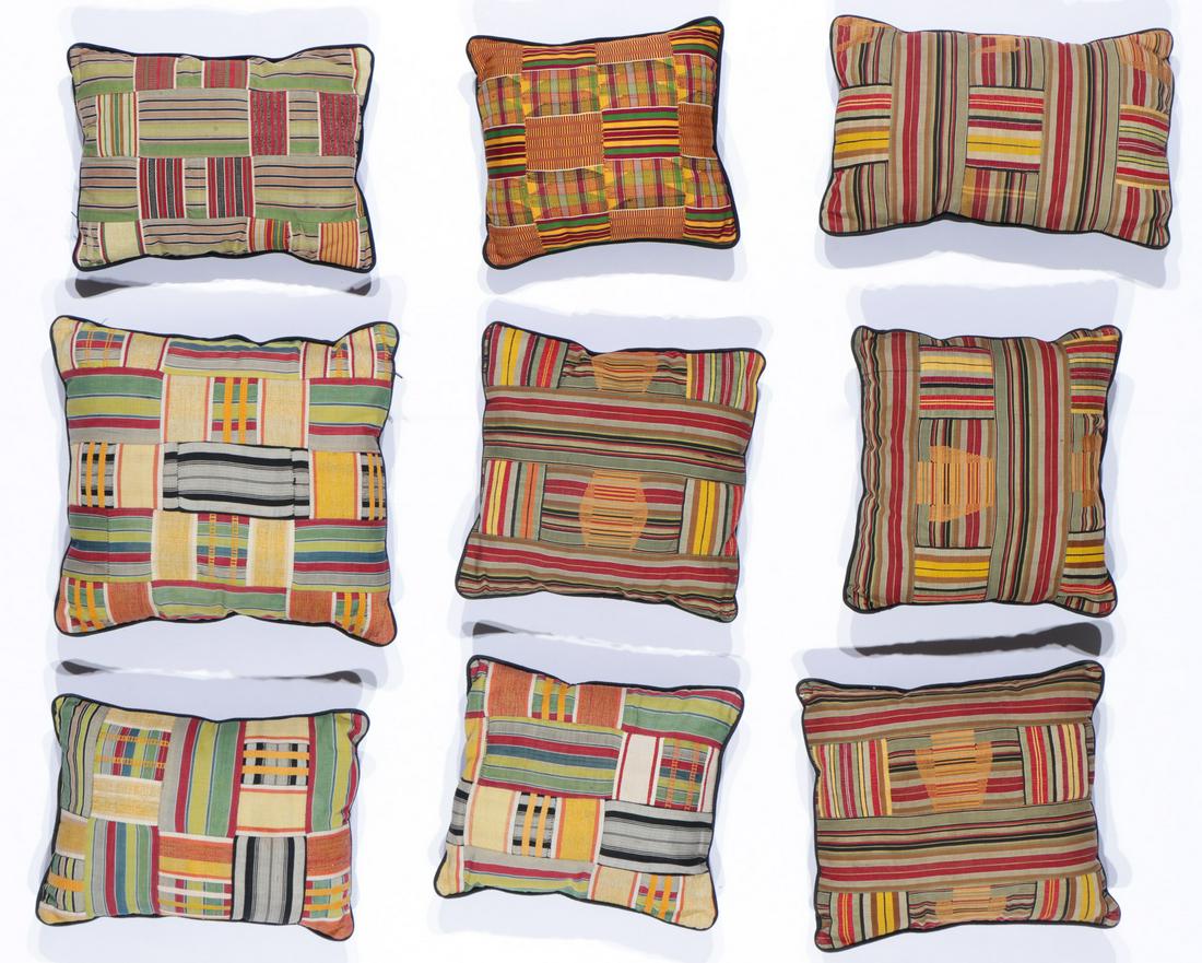 Group of Nine African Kente Cloth Pillows: Group of Nine African Kente Cloth Pillows. Ranging in Size from: 14'' x 12'' x 5'' (36 x 30 x 13 cm) to 10.5'' x 9'' x 4.5'' (27 x 23 x 11 cm).