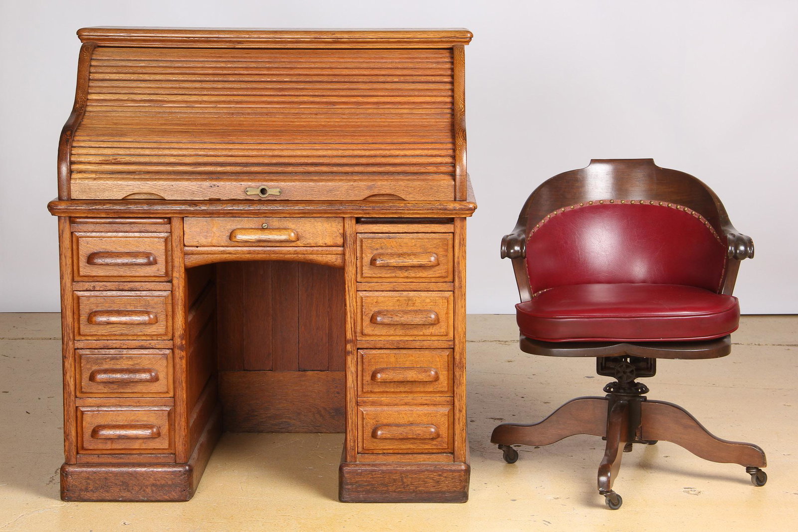 Antique Oak Rolltop Desk and Associated Chair: Antique Oak Rolltop Desk and Associated Chair. Size: 46'' x 42'' x 30'' (117 x 107 x 76 cm).