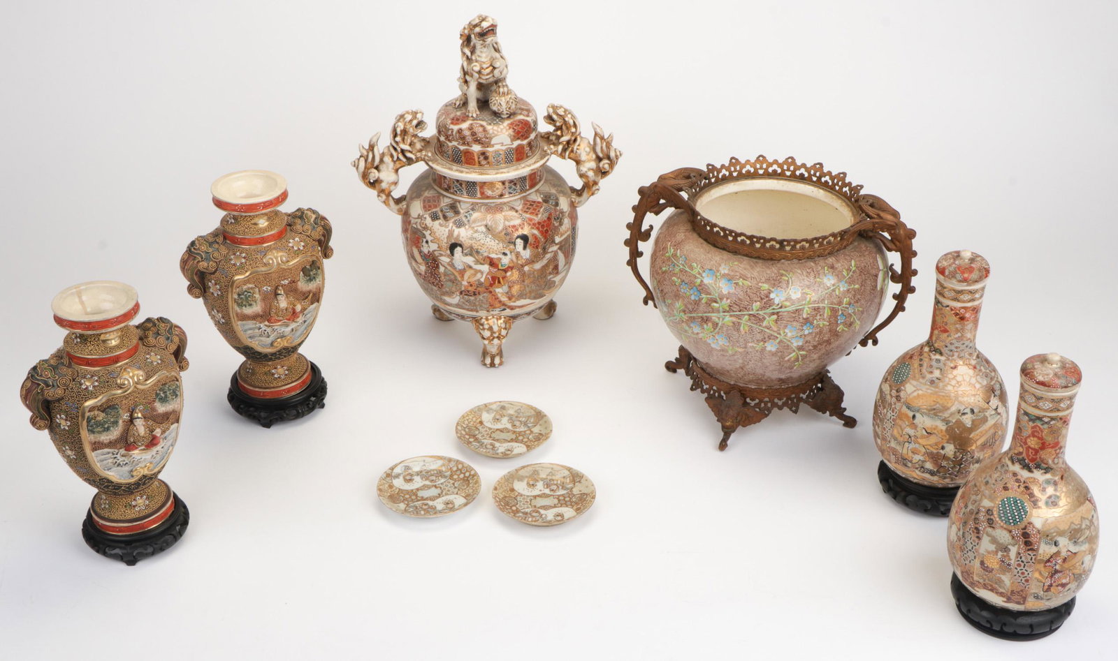 Group of Japanese Satsuma Pottery: Group of Japanese Satsuma Pottery. Comprising a pair of covered long neck jugs, a pair of amphoras, four small plates, and a censer. Ranging in Size from: 18'' x 13'' x 7'' (46 x 33 x 18 cm) to 4.5'' 