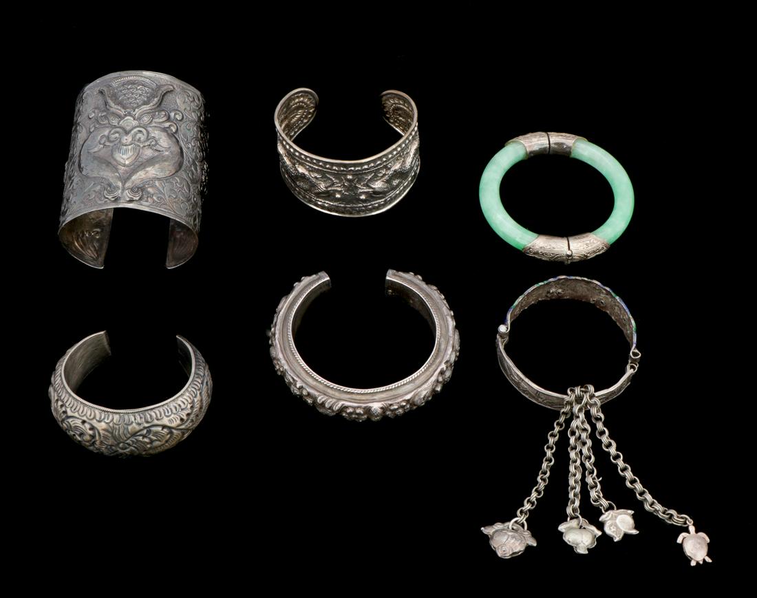 Collection of 6 Antique/Vintage Thai Silver Bracelets: Collection of 6 antique/vintage Thai silver bracelets. 10.63 ozt. Ranging in size from: 3'' x 2.5'' (8 x 6 cm) to .75'' x 2.5'' (2 x 6 cm). Provenance: Private South Carolina Collection. Please Note: 