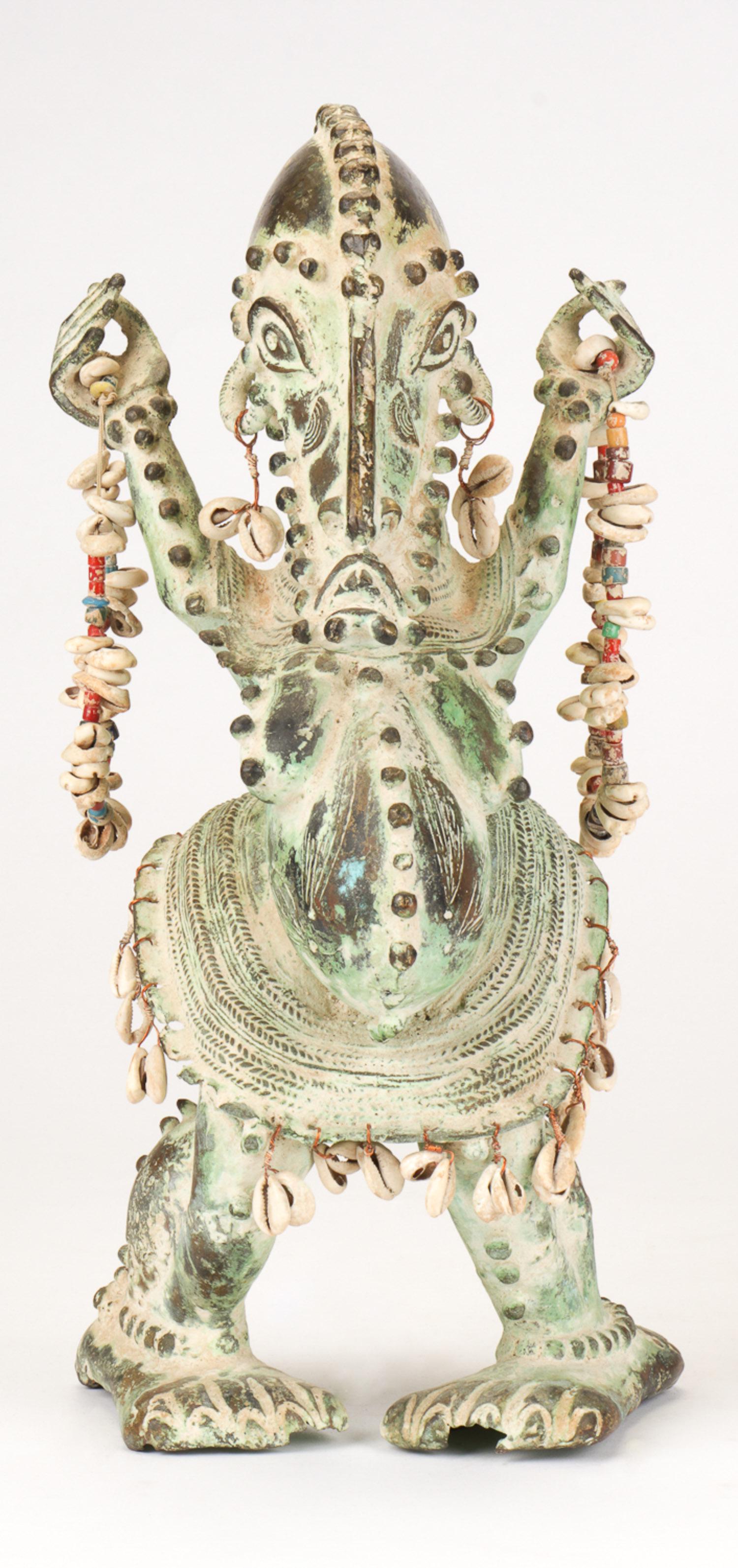 Unusual African Bronze Zoomorphic Figure, Nigeria.: Unusual African Bronze Zoomorphic Fetish Figure, Nigeria. Patinated bronze with cowrie shell beaded decoration. Collection of Allan Stone, New York. Size: 18.75" x 8.5" x 11" (48 x 22 x 28 cm). Please