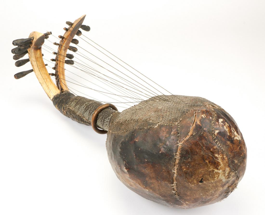 African Loango Harp: African Loango Harp. Wood, bone, skin and string. Provenance: Collection of Allan Stone, New York. Size: 30'' x 94'' x 14.5'' (76 x 239 x 37 cm). Please Note: There Are No Hidden or Confidential Reser