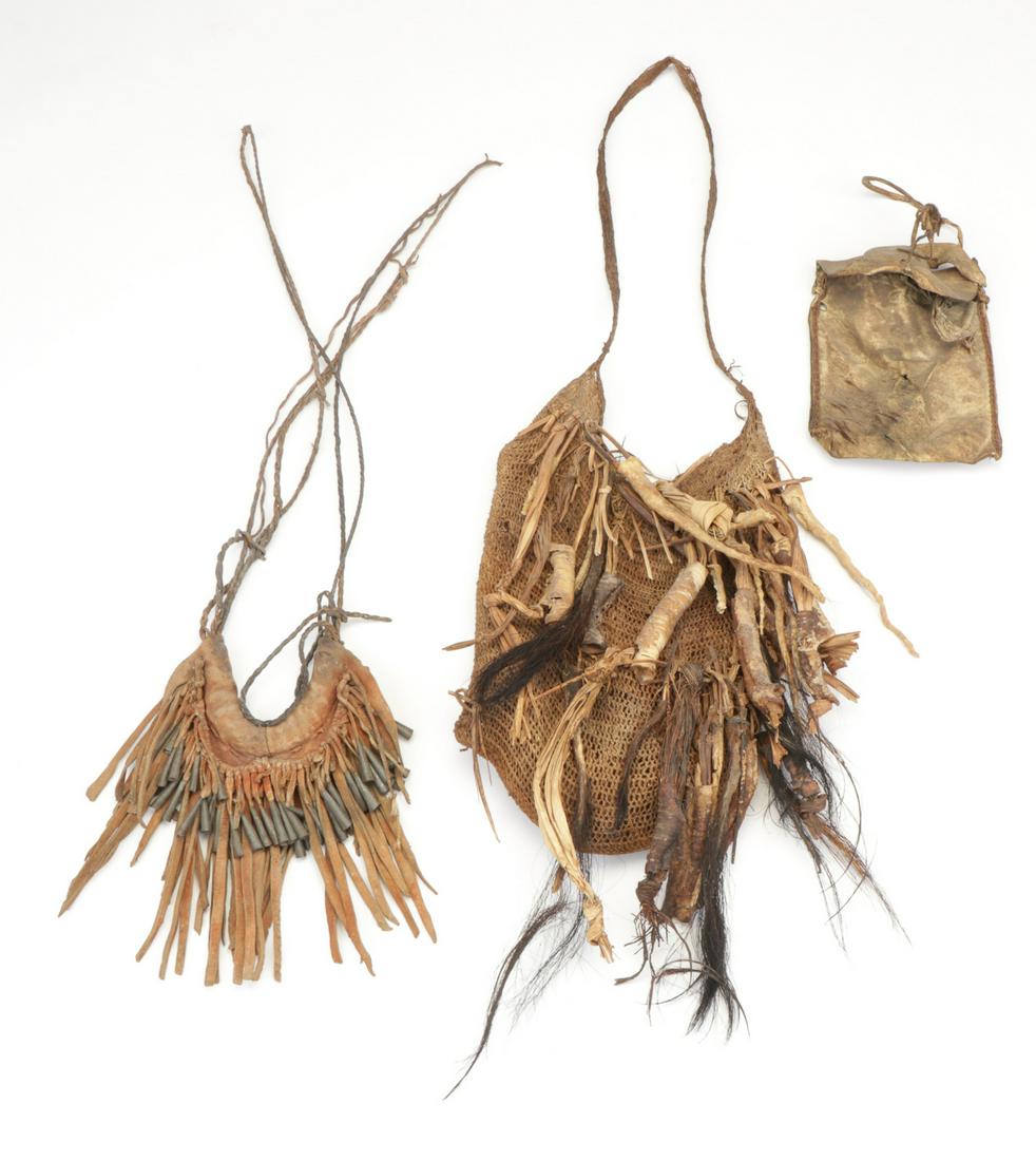 Two African Leather Satchels and a Pectoral: Two African Leather Satchels and a Pectoral. Leather, skin, burlap, bone and metal. Provenance: Collection of Allan Stone, New York. Ranging in size from: 6.5'' x 5.5'' (17 x 14 cm) to 14'' x 8.5'' (3