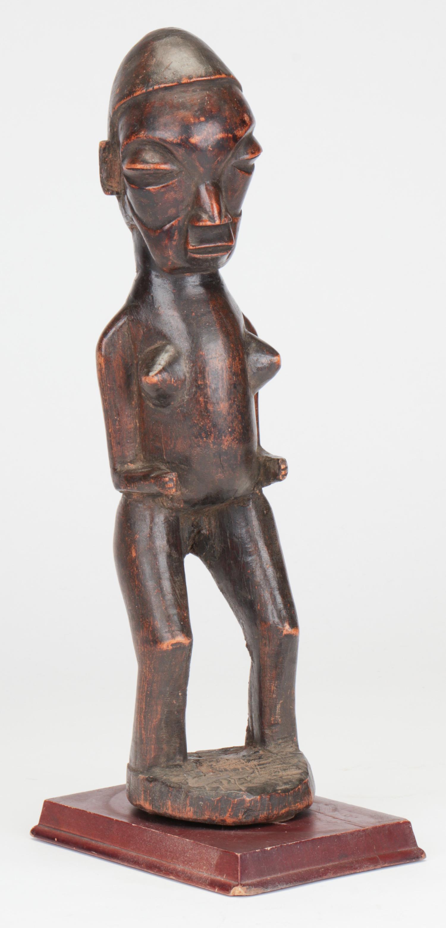 Yaka Fetish Figure, Central Africa: Yaka Fetish Figure, Central Africa. Carved wood with rich patina. Ex Collection of Bernard Barauch, Chicago. Size: 14.25'' x 3'' x 3'' (36 x 8 x 8 cm). Height on stand: 15" (38 cm). Please Note: There