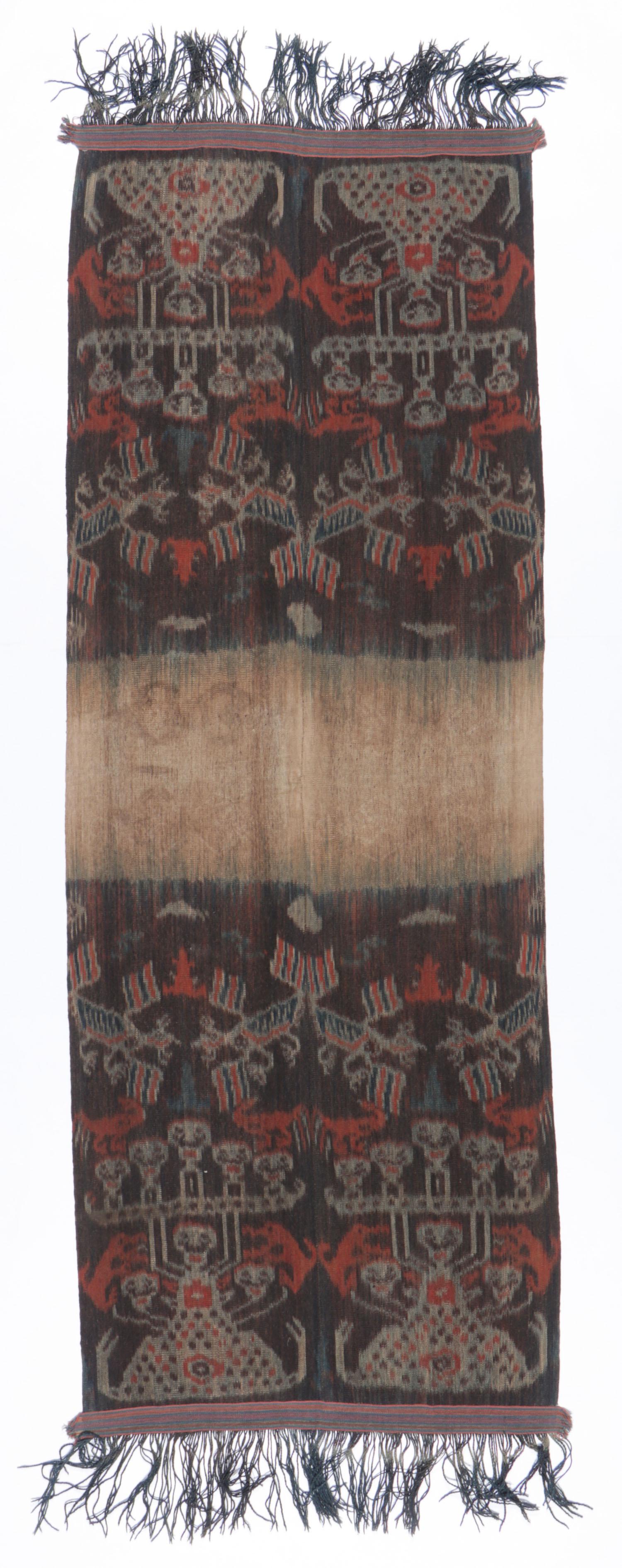 East Sumba Ikat Hinggi Textile: East Sumba Ikat Hinggi Textile. Handspun cotton ikat man's mantle or "hinggi", mid 20th c, East Sumba, Indonesia. Size: 124'' x 39'' (315 x 99 cm). Provenance: Apsara Arts of Asia. Please Note: There 