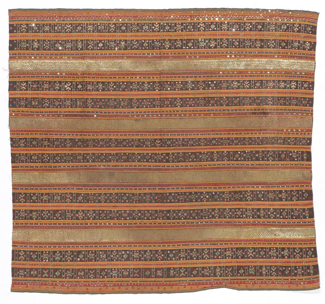 Antique Indonesian Ceremonial "Tapis Kaca" Skirt: Antique Indonesian Ceremonial "Tapis Kaca" Woman's Skirt. Gold-wrapped thread couched on cotton ground, mica, silk thread, Lampung, Sumatra. Tapis are heavily ornamented ceremonial sarongs made and wo