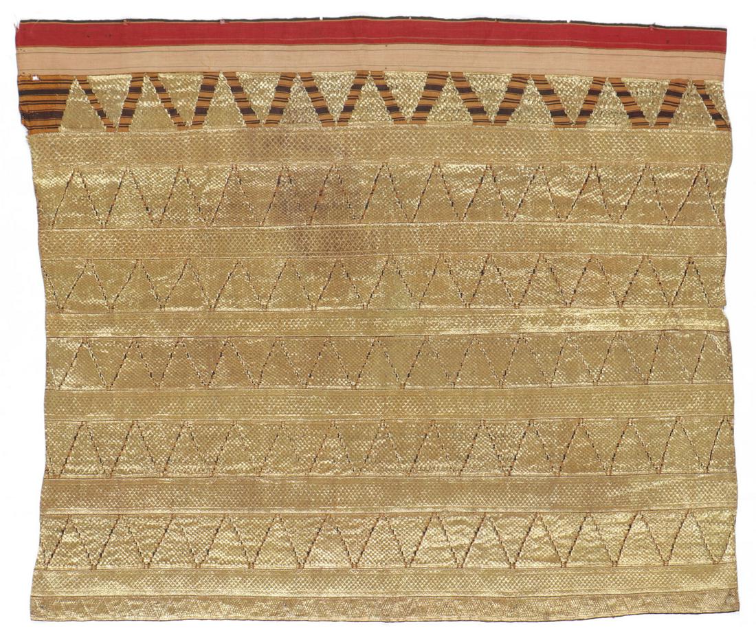 Antique Indonesian Ceremonial Tapis Textile: Antique Woman's Ceremonial Tube Kkirt, "Tapis." Gold-wrapped thread couched on natural dyed cotton, Abung people, Lampung, Sumatra. Tapis are heavily ornamented ceremonial sarongs made and worn by wom