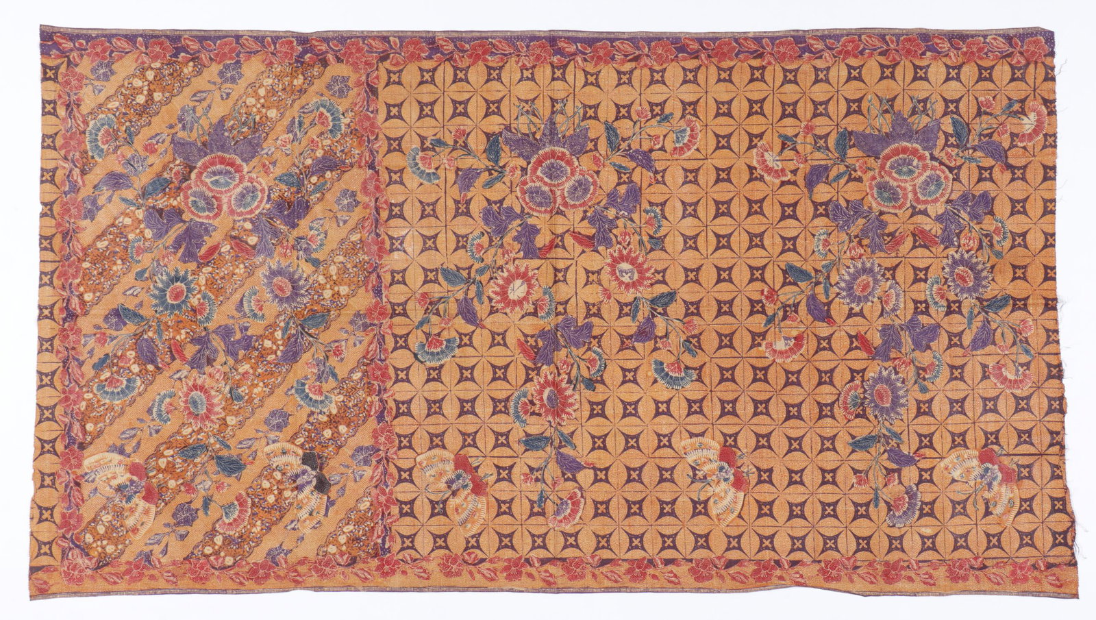Handdrawn Indonesian Batik Sarong: Handdrawn Indonesian Batik. Opened sarong in batik tulis. The badan with flowers, butterflies on a latticed background in indigo and red on an ochre and cream background. The kepala of flowers on a di