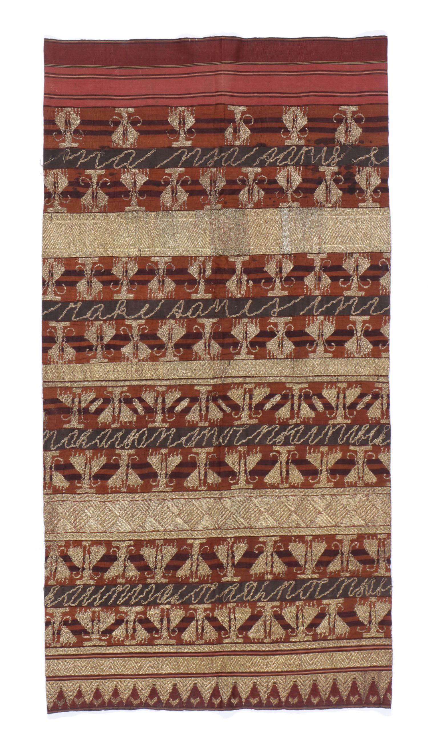 Antique Indonesian Ceremonial Tapis, Lampung: Antique Indonesian ceremonial tapis (sarong) woven with gold covered thread, Lampung. Traditional hand woven women_Ñés sarong worn by the Abung people, an ethnic group of people originating from the