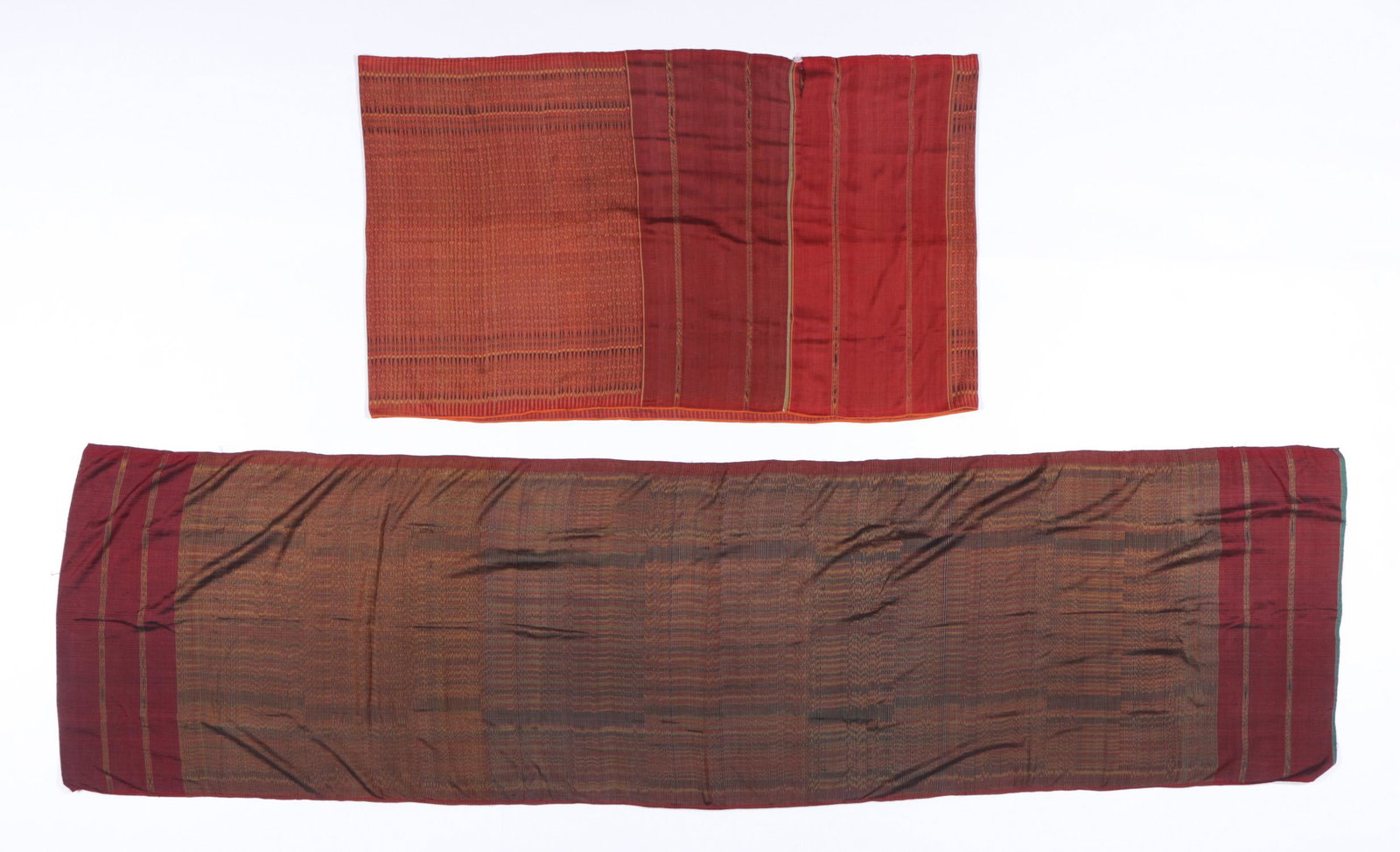2 Cambodian Silk Ikat Hipwrapper Textiles: 2 Cambodian silk ikat hipwrapper (samphot hol) textiles with ends sewn together to make tube skirt. Sizes: 1) 120'' x 32'' (305 x 83 cm); 2) 33'' x 57'' (84 x 145 cm). Provenance: Private South Caroli