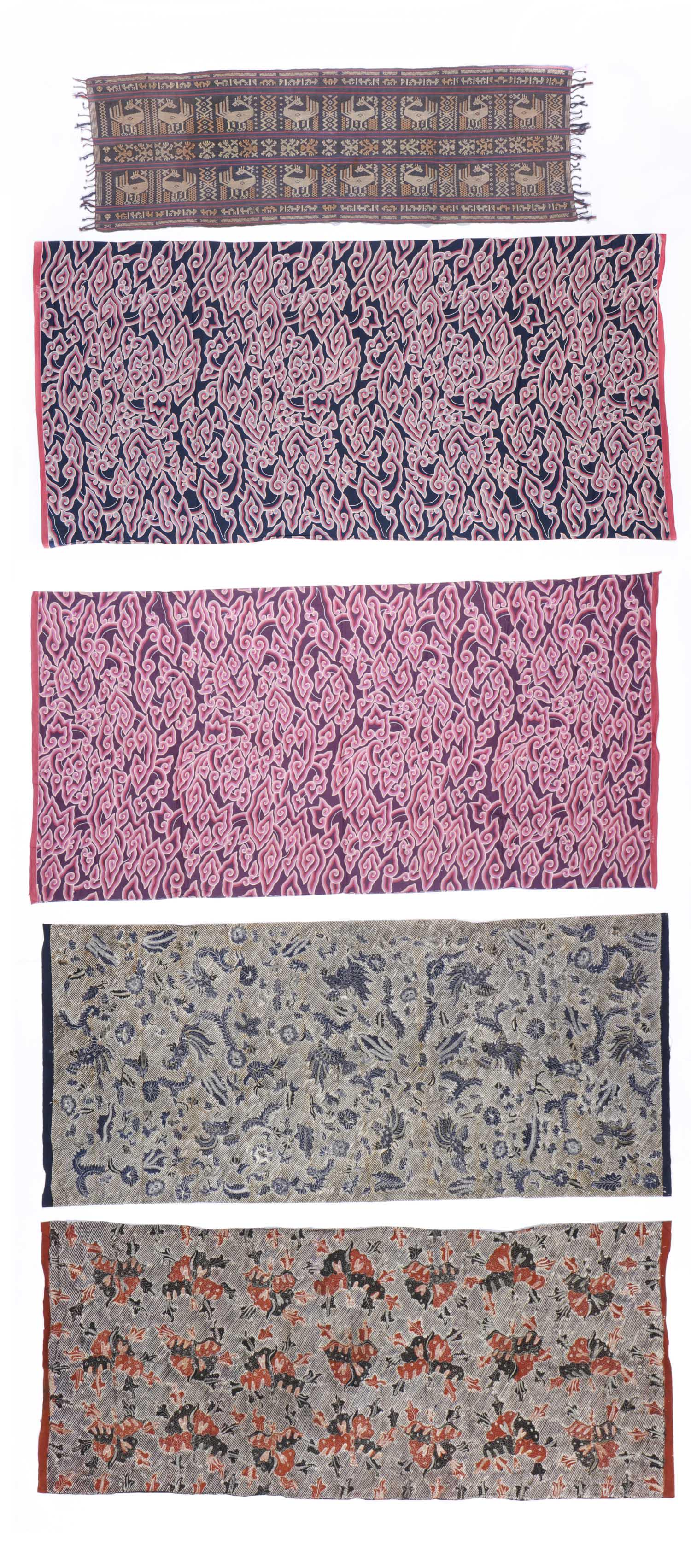 5 Indonesian Textiles, 20th c: 5 Indonesian textiles including 2 handdrawn batiks, 2 printed batik patterned cloths and handwoven Sumba textile. 20th c. Ranging in size from: 21'' x 64.5'' (53 x 164 cm) to 85.5'' x 43'' (217 x 109 