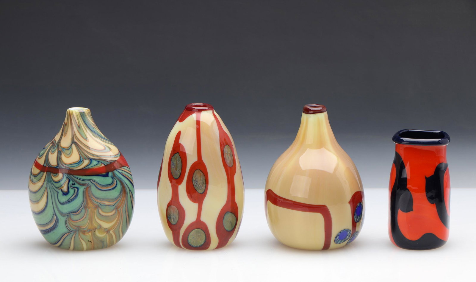 George Thiewes (American, b. 1943) Art Glass Group: George Thiewes (American, b. 1943) Art Glass Group. Four Vases. Sizes ranging from 3.75'' x 2.5'' x 2.5'' (10 x 6 x 6 cm) to Size: 4.75'' x 3.5'' x 3.5'' (12 x 9 x 9 cm).