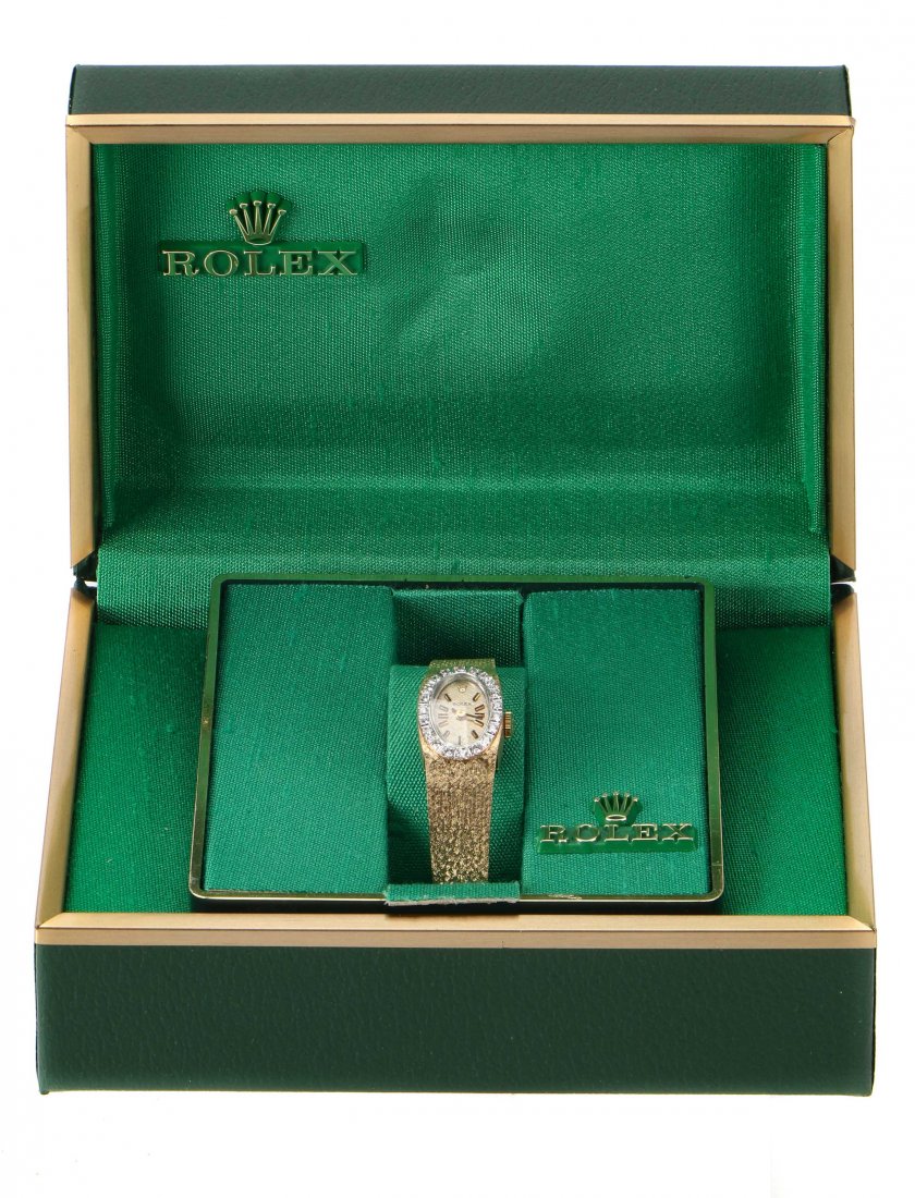 Rolex Ladies 14K Diamond Bracelet Wrist Watch: Rolex Ladies 14K Diamond Bracelet Wrist Watch. Back marked 14K gold and inscribed: "S.S.M. 1985." In original case and box. Size: 6'', 15 cm (band). Property from a Philadelphia Estate.