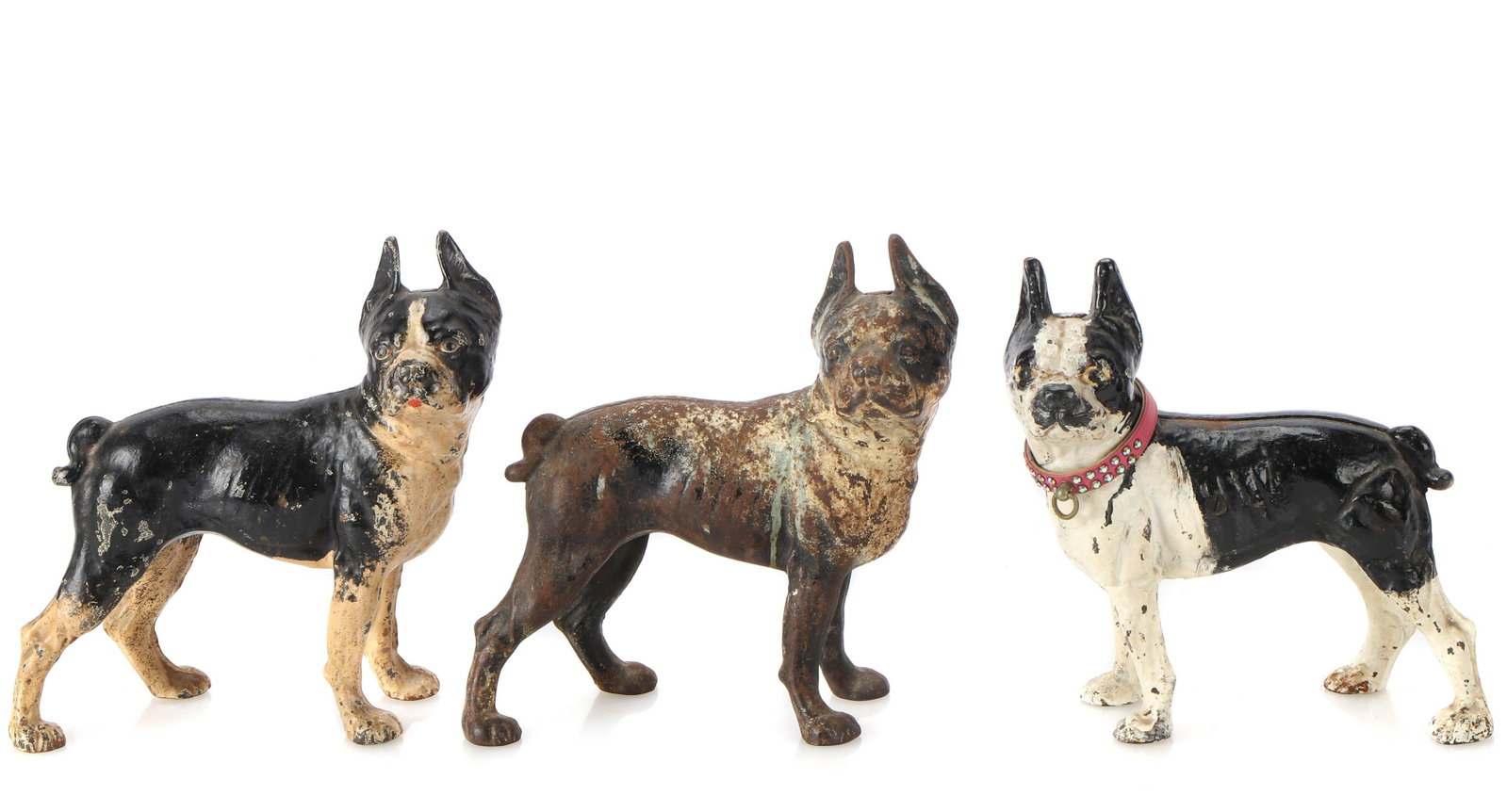 3 Hubley Cast Iron Boston Terrier Door Stops: Group of 3 Hubley Cast Iron Boston Terrier Door Stops. Including one rare left-facing example. Property from a Philadelphia Estate. Sizes: 1) 10'' x 10'' x 4.75'' (25 x 25 x 12 cm); 2) 10'' x 10'' x 4