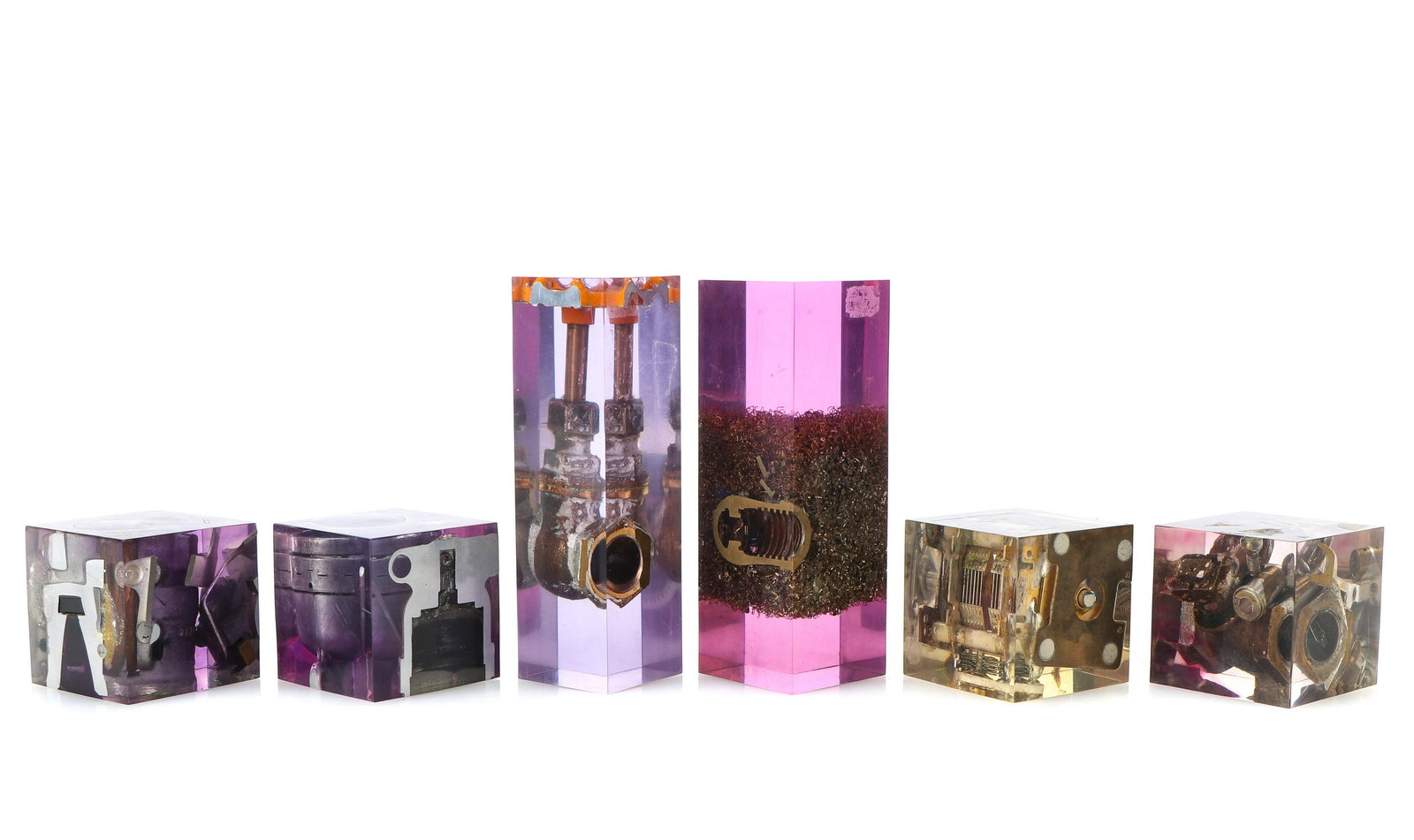 Manner of Arman (Pierre Fernandez) (French, 1928-2005): Manner of Arman (Pierre Fernandez)(French, 1928-2005) Group of Six Lucite and metal cubes. Sizes ranging from: 2.5'' x 2.5'' x 2.5'' (6 x 6 x 6 cm) to 6'' x 2'' x 2'' (15 x 5 x 5 cm). Private Collecti