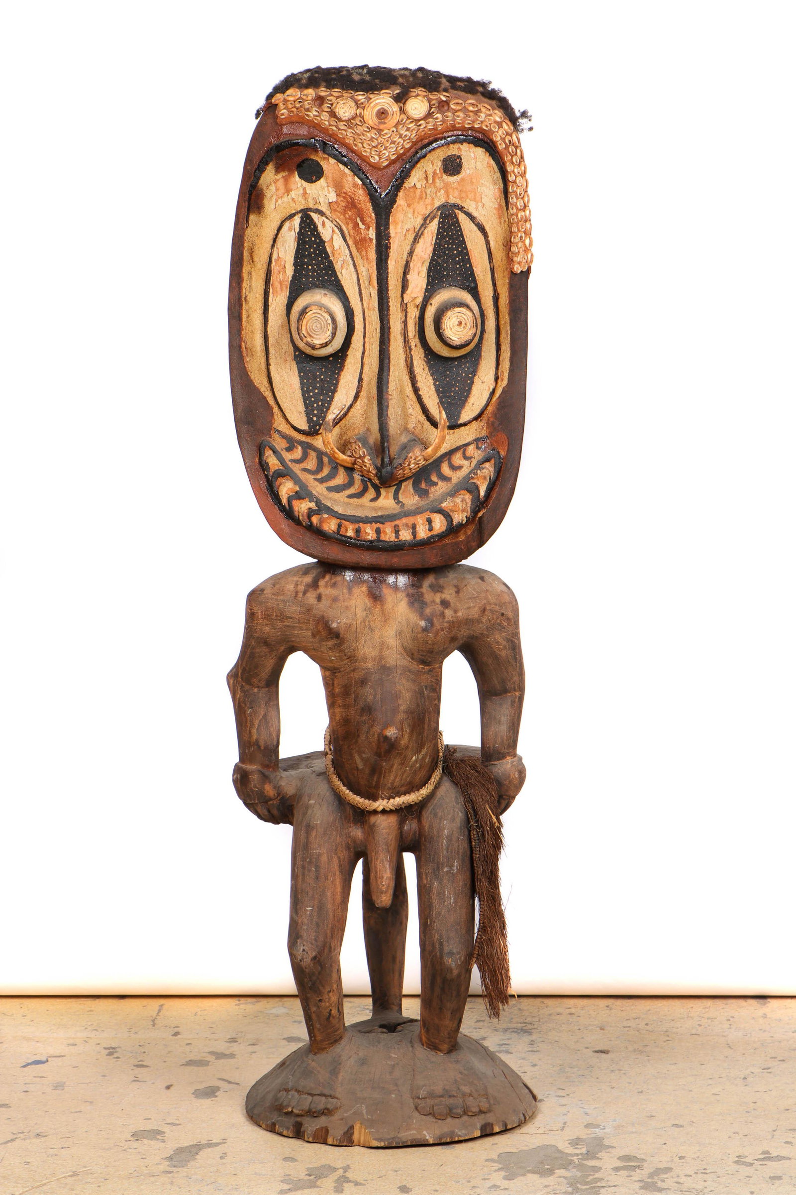 Sepik River Orator's Stool, PNG. Early/Mid 20th C., Ht.: Sepik River Orator's Stool, PNG. Carved wood, shells bone, hair and pigment. These were used during ceremonial debates in which the speaker struck the stool-like projection behind the figure with bund